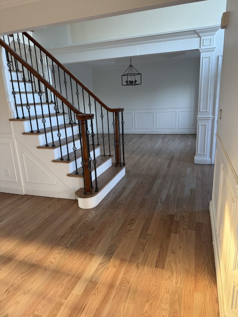 Wood Flooring in Foyer with Staircase